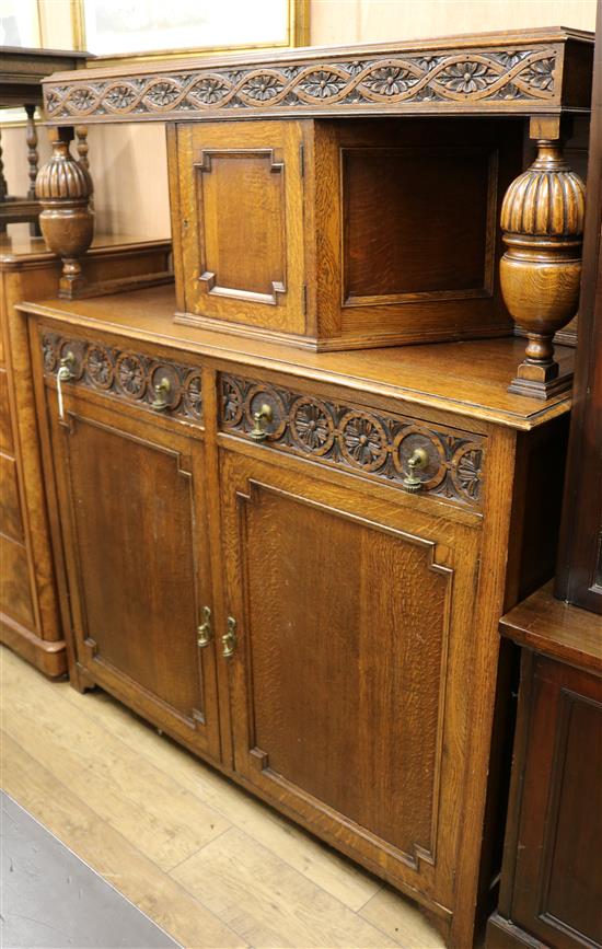 A 1920s oak court cupboard W.137cm